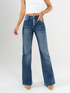 Ref: 065634 Jean flare stretch, bota ancha, botones expuestos, tiro alto, tono azul oscuro