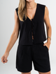 Ref: 069756 Chaleco escote V y manga sisa, anudado al frente, tejido plano liviano, tono negro