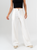 Ref: 069824 Pantalón palazzo, detalle delantero, tejido plano liviano, tiro alto, tono ivory