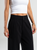 Ref: 069874 Pantalón mom flare, tejido plano liviano, prenses, tiro alto, detalle en pretina, tono negro