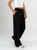 Ref: 069874 Pantalón mom flare, tejido plano liviano, prenses, tiro alto, detalle en pretina, tono negro
