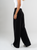 Ref: 069874 Pantalón mom flare, tejido plano liviano, prenses, tiro alto, detalle en pretina, tono negro