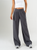 Ref: 069876 Pantalón mom flare, tejido plano liviano, prenses, tiro alto, detalle en pretina, tono gris