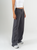 Ref: 069876 Pantalón mom flare, tejido plano liviano, prenses, tiro alto, detalle en pretina, tono gris