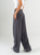 Ref: 069876 Pantalón mom flare, tejido plano liviano, prenses, tiro alto, detalle en pretina, tono gris