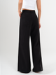 Ref: 069946 Pantalón palazzo, prenses, tono negro, tejido plano liviano, tiro alto