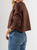 Ref: 0610430 Buzo oversize, manga larga, con cortes, cuello redondo en rib, tono cafe